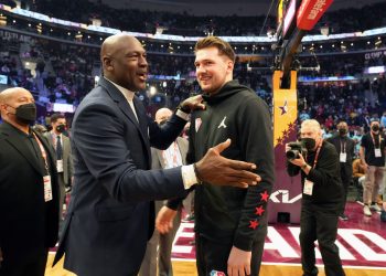 Chicago Bulls legend Michael Jordan (L) speaks with Dallas Mavericks star Luka Doncic during halftime of the 2022 NBA All-Star Game