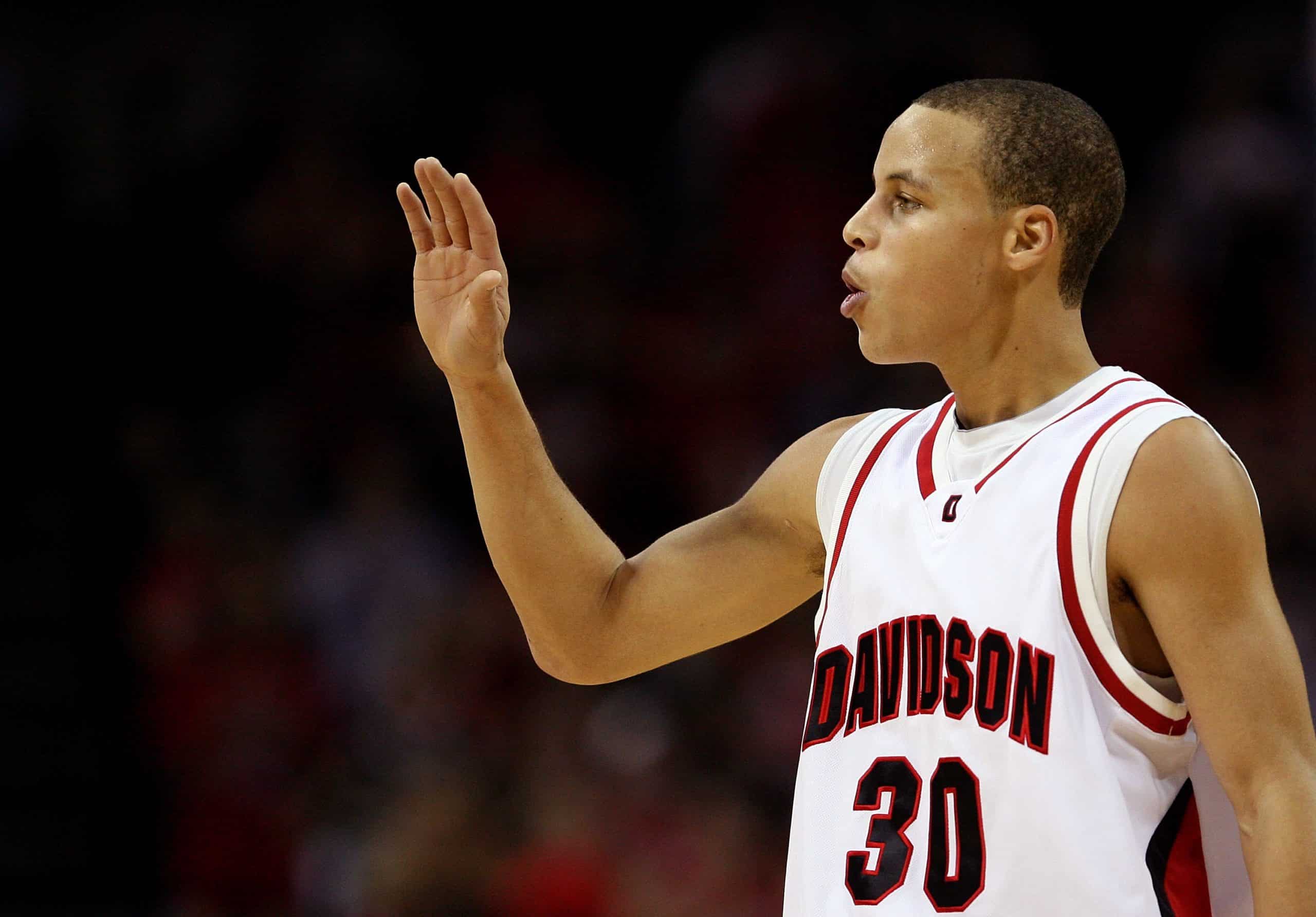 Stephen Curry of the Davidson Wildcats reacts to his team's 72-67 victory over the North Carolina State Wolfpack.