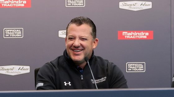 Tony Stewart speaks during a press event announcing a partnership between Stewart-Haas Racing and Mahindra Tractors at Indianapolis Motor Speedway on Dec. 10, 2021.