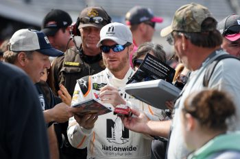 Dale Earnhardt Jr. signs autographs