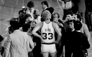 Boston Celtics player Larry Bird talks to the media.