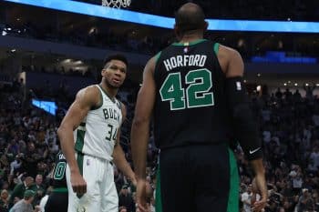 Giannis Antetokounmpo of the Milwaukee Bucks stares at Al Horford of the Boston Celtics.