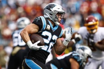 Christian McCaffrey runs with the ball