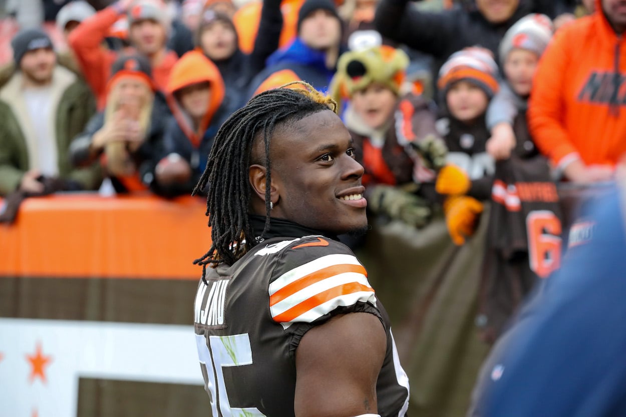 Cleveland Browns tight end David Njoku arrives at game in beige mask before  donning a balaclava to warm up after suffering burn injuries to his face  this week but still suits up