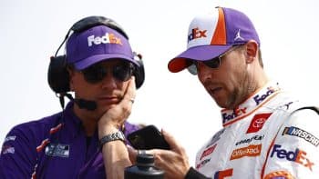 Denny Hamlin and crew chief Chris Gabehart talk on the grid during qualifying for the NASCAR Cup Series Jockey Made in America 250 at Road America on July 4, 2021.