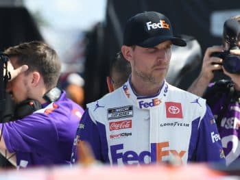 Denny Hamlin looks on during practice