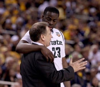 Draymond Green embraces Tom Izzo.