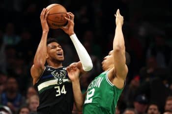 Grant Williams of the Boston Celtics defends Giannis Antetokounmpo of the Milwaukee Bucks.