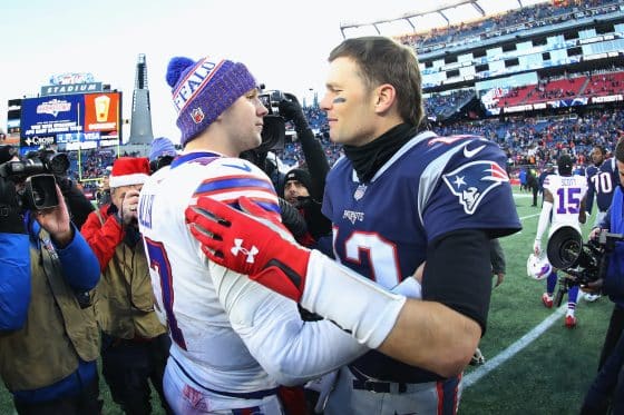 Josh Allen and Tom Brady embrace after a game. The two QBs play in 'The Match' on June 2.