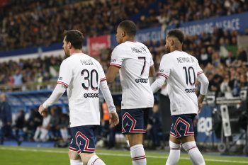 Lionel Messi, Kylian Mbappé, and Neymar of PSG look on during the Ligue 1 match in 2022.