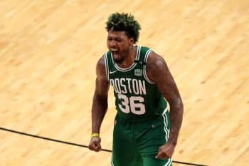 Marcus Smart of the Boston Celtics reacts after a three-point basket.