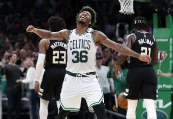 Celtics guard Marcus Smart exults after he hit a fourth-quarter three-pointer.