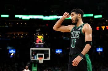 Jayson Tatum of the Boston Celtics looks on during a timeout against the Miami Heat.