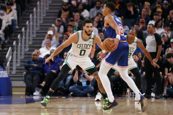 Jayson Tatum guards Jordan Poole.