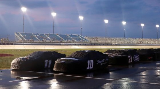 Cars sit covered on the grid during a weather delay in the NASCAR Cup Series Ally 400 at Nashville Superspeedway on June 26, 2022 in Lebanon, Tennessee.