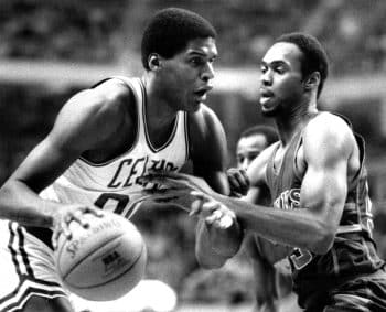 Boston Celtics Robert Parish, left, attempts to get around Milwaukee Bucks Alton Lister.