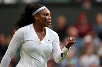 Serena Williams celebrates after winning a point at Wimbledon 2022.