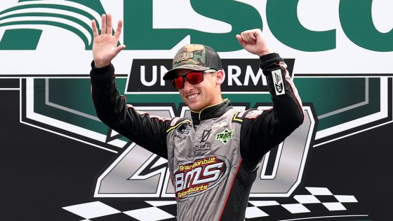 Brandon Brown waves to fans during driver introductions for the NASCAR Xfinity Series Alsco Uniforms 250 at Atlanta Motor Speedway on July 9, 2022.