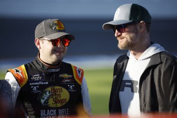 Noah Gragson and NASCAR Hall of Famer Dale Earnhardt Jr. talk on the grid at Daytona International Speedway on Feb. 19, 2022.