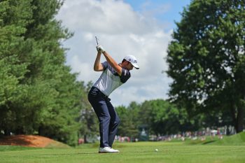 Davis Riley hits a shot from the tee.