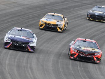 Denny Hamlin, Kyle Busch, and Martin Truex Jr. race