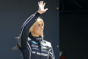 Hailie Deegan waves to fans