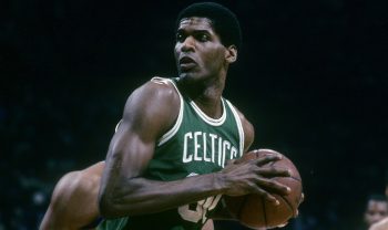 Robert Parish of the Boston Celtics backs in against a defender of the Washington Bullets.