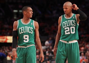 (L-R) Rajon Rondo and Ray Allen of the Boston Celtics talk on court.