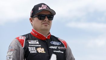 Cole Custer, driver of the No. 41 Ford, walks the grid prior to the NASCAR Cup Series Kwik Trip 250 at Road America on July 3, 2022 in Elkhart Lake, Wisconsin.