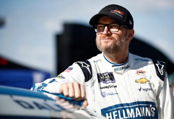 Dale Earnhardt Jr. stands by his car during a NASCAR Xfinity Series practice