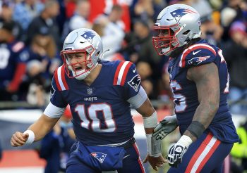 Mac Jones and Isaiah Wynn during a Patriots-Browns matchup in November 2021