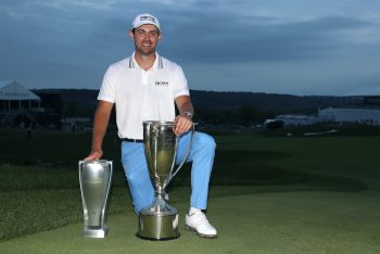 Patrick Cantlay poses with the BMW Championship trophy.