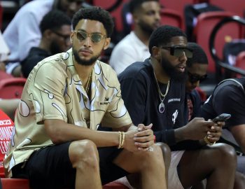 Ben Simmons watches a game from the bench.