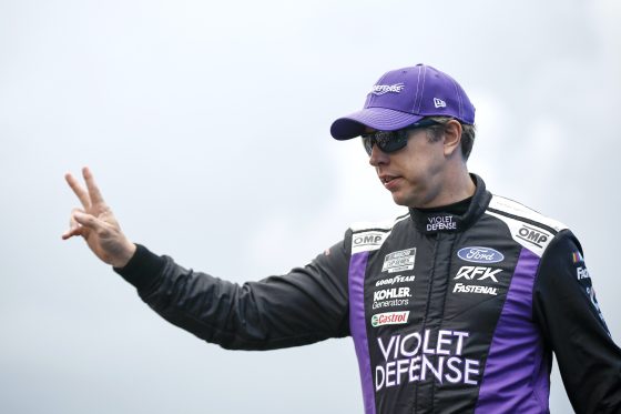 Brad Keselowski waves to fans