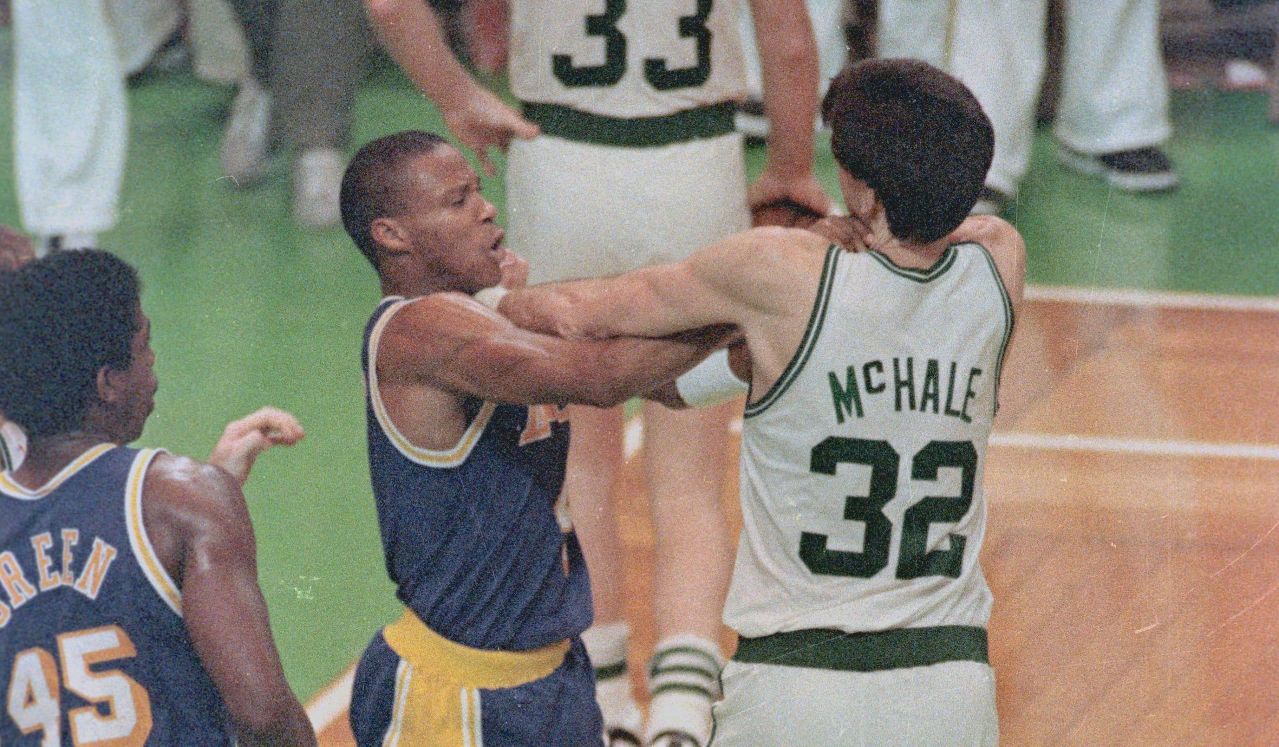 Los Angeles Lakers guard Byron Scott and Boston Celtics forward Kevin McHale fight.