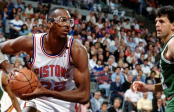 John Salley of the Detroit Pistons looks to pass the ball.