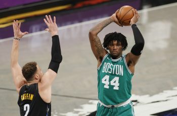 Robert Williams III of the Boston Celtics looks to pass.