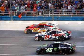 Bubba Wallace, William Byron, and Kurt Busch racing at Talladega.