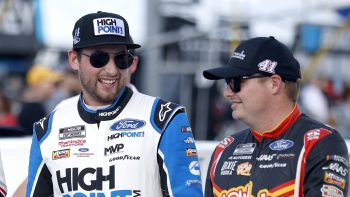 Chase Briscoe and Cole Custer walk the grid together prior to the NASCAR Cup Series Cook Out Southern 500 at Darlington Raceway on Sept. 4, 2022.