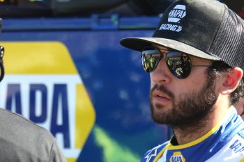 Chase Elliott talks with members of his crew during qualifying for the NASCAR PYellaWood 500 on Oct. 1, 2022 at Talladega Superspeedway.