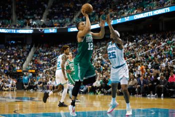 Grant Williams of the Boston Celtics drives to the basket.