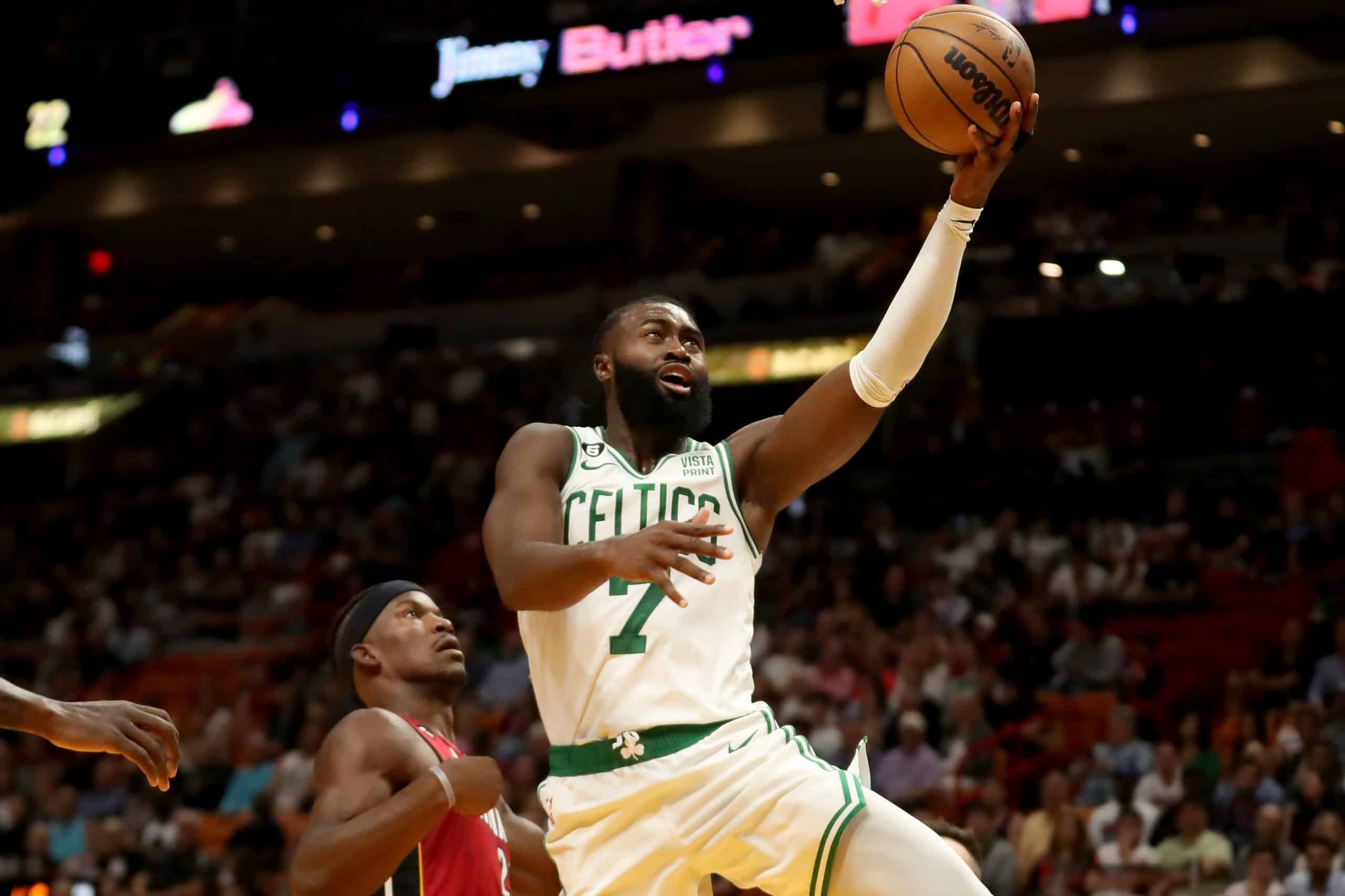 Jaylen Brown of the Boston Celtics shoots past Jimmy Butler of the Miami Heat.