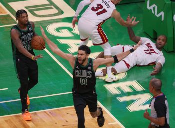 Boston Celtics forward Jayson Tatum cannot believe the offensive foul called on his made layup against the Miami Heat.