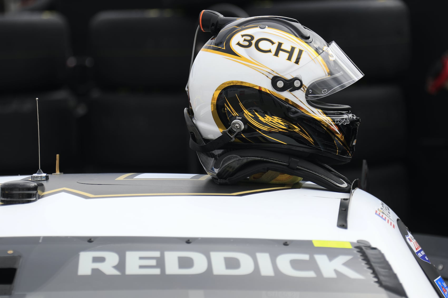 Tyler Reddick helmet on top of car