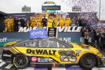 Christopher Bell (C) celebrates a win at Martinsville Speedway.