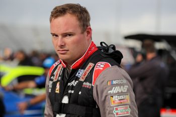 Cole Custer walks the grid during qualifying for the NASCAR Cup Series Blue-Emu Maximum Pain Relief 400 at Martinsville Speedway on April 8, 2022.