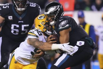 Jalen Hurts breaks a tackle during a game against the Packers.