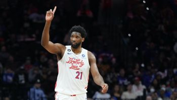 Joel Embiid puts up a finger during a game against the Jazz.