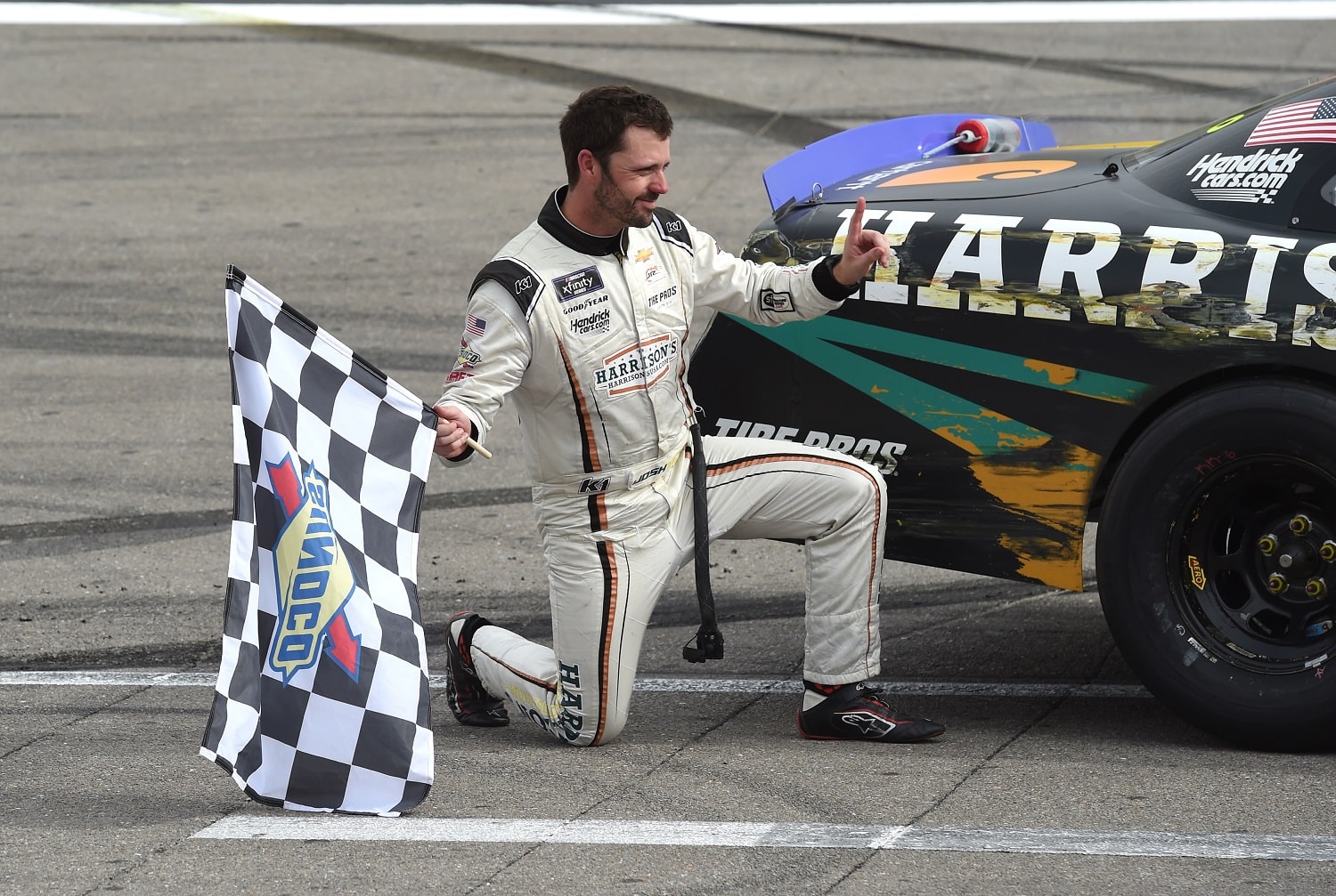 Josh Berry poses with his car after winning the NASCAR Xfinity Series Alsco Uniforms 302 on Oct. 15, 2022, at Las Vegas Motor Speedway. | Chris Williams/Icon Sportswire via Getty Images