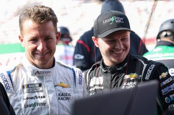 AJ Allmendinger and Justin Haley of Kaulig Racing talk on the grid during practice for the NASCAR Cup Series Bank of America Roval 400 at Charlotte Motor Speedway on Oct. 8, 2022.